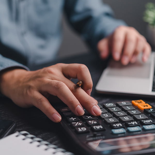 A man using a calculator