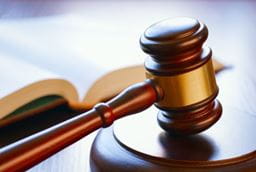 Close up of a book and a gavel