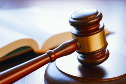 Close up of a book and a gavel