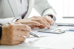 A man using a calculator