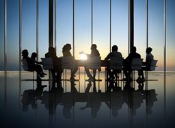 silhouette of people in a meeting