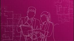 Two people look at paperwork