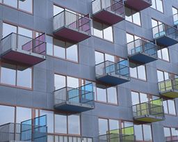 Colourful balconies outside a block of flats